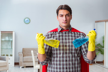 Super hero cleaner working at home