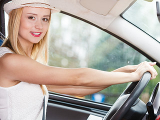 Fototapeta na wymiar Pretty woman driving her car