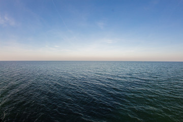 smooth sea with clear blue sky background at the baltic coast
