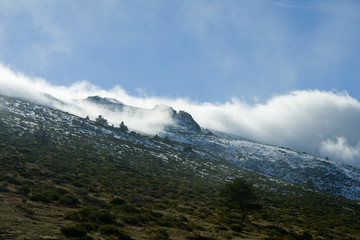 Obraz na płótnie Canvas Mountain with clouds and snow