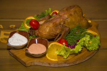 Roast partridge with fresh vegetables.