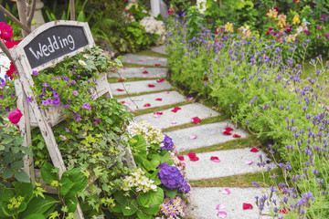 Romantic path to wedding banquet in beautiful green garden