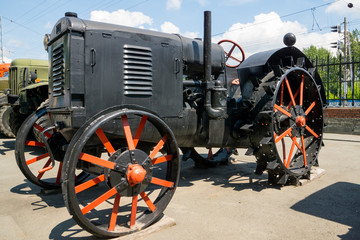 Fototapeta na wymiar vintage black steel wheels tractor
