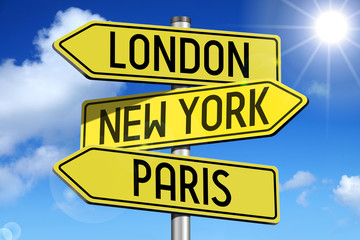 London, New York, Paris - signpost with yellow arrows.