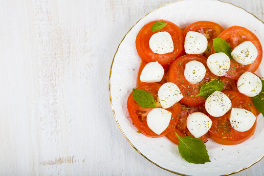 Caprese salad on a wooden table