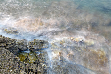 Aegean shore in Greece, Thassos island - waves and rocks - long exposure photography
