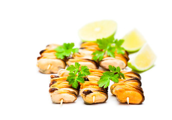 Mussels  grilled in herbs and lime isolated on white background