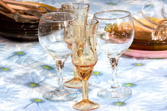 Wine glass with water droplets standing on the table.