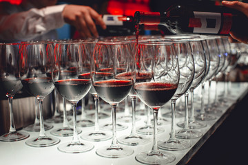 lot of glasses with red wine close-up