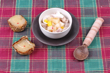 Nian gao dumplings and taro in coconut cream.