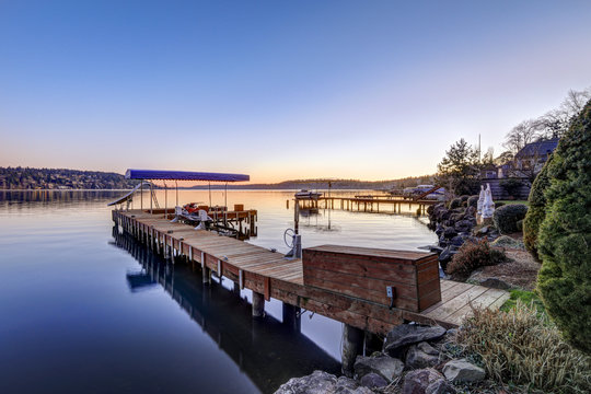 Private dock with jet ski lifts and covered boat lift, Lake Washington.