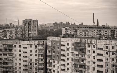 Fototapeta na wymiar apartment buildings district and factory background, air pollution