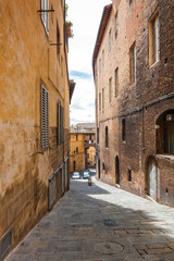 View of one of the streets of Siena, Toscana region, Italy.