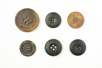 Many old Round buttons with cracks on white