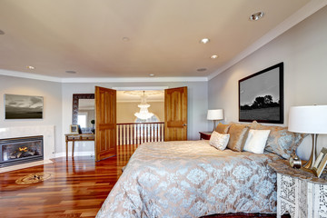 Chic master bedroom interior with fireplace