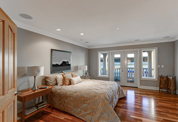 Chic master bedroom interior with private balcony