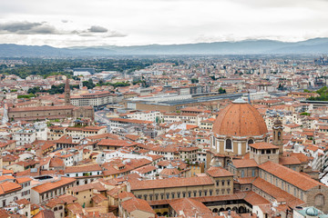 Fototapeta na wymiar Cloudy view of Florence from viewpoint at top of the dome of Santa Maria del Fiore, Toscana region, Italy.