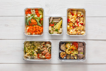 Healthy food take away, top view at wood background