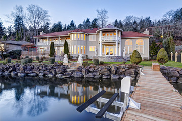 Luxurious waterfront home exterior. View from the deck.