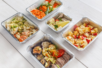 Healthy food take away, top view at wood background