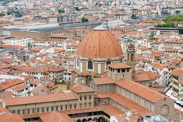 Fototapeta na wymiar Cloudy view of Florence from viewpoint at top of the dome of Santa Maria del Fiore, Toscana region, Italy.