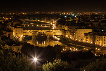 Fototapeta na wymiar Night view of famous bridge Ponte Vecchio over Arno river in Florence, Toscana province, Italy.