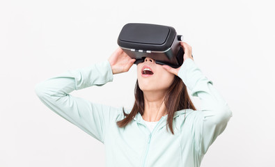 Excited woman looking though the Virtual reality glasses
