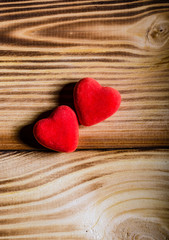 Happy Valentine's Day. Two red hearts on wooden background. Love
