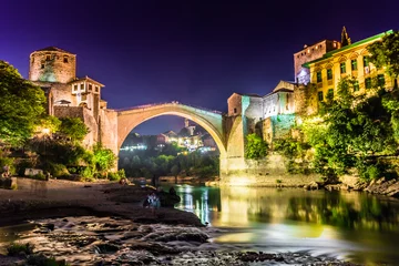 Papier Peint photo autocollant Stari Most July 11, 2016: Stari Most bridge lit up by night in the town of Mostar