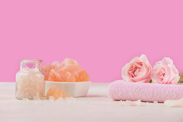 Spa settings with roses. Various items used in spa treatments on