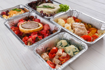 Healthy food take away, top view at wood background