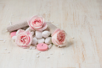 Spa settings with roses. Various items used in spa treatments on