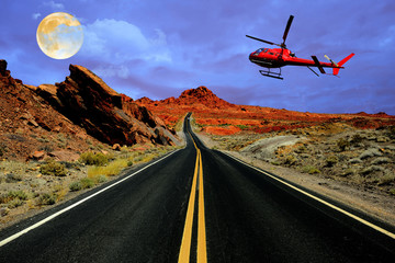 Fototapeta na wymiar Helicopter tour over desert road with full moon
