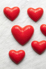 Red hearts covered with drops of water