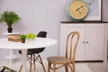 Neutral interior with table on gray wall background