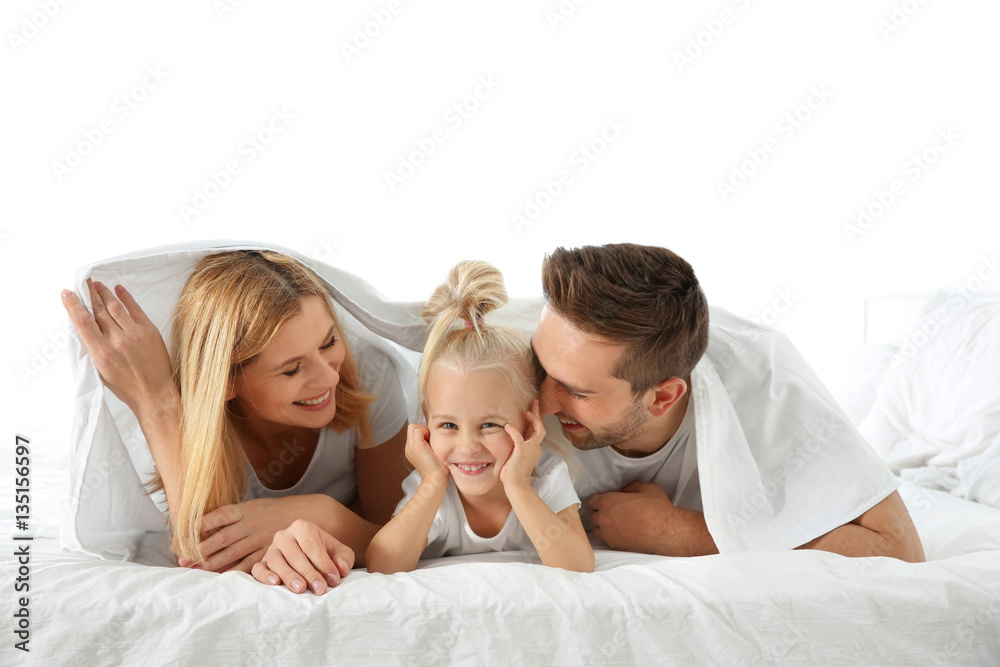 Canvas Prints cute little girl with parents lying on bed under white sheet