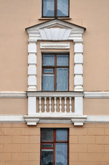 Obraz premium Window of a historic building decorated with classic white elements. Stalin's empire style.