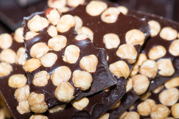 Pieces of chocolate with hazelnuts