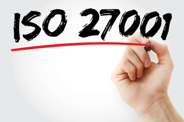 Hand writing ISO 27001 with marker, business concept background