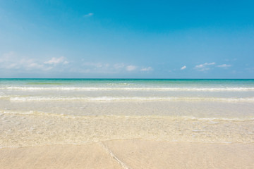 Fototapeta na wymiar Beautiful ripples wave at the sandy beach
