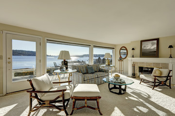 Cozy light filled family room with a wall of windows