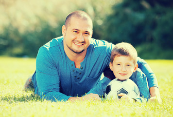 Naklejka na ściany i meble son and father with football ball.
