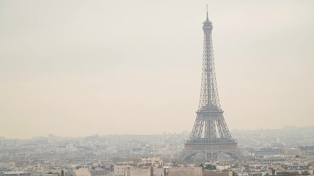 Paris skyline with Eiffel tower in focus.