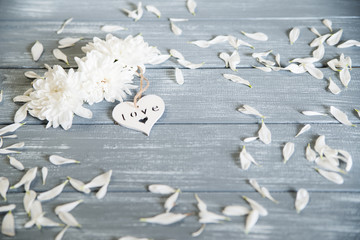Happy Valentines Day background. Decorative white wooden heart on grey rustic. Valentine's concept.