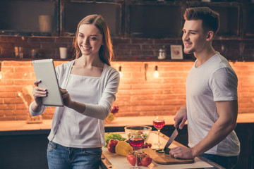 Beautiful couple cooking