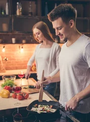 Wall murals Cooking Beautiful couple cooking