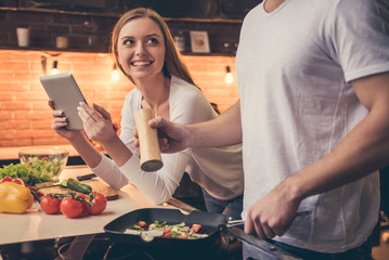 Beautiful couple cooking