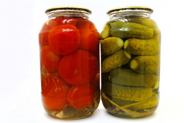 Home canning. Canned vegetables in glass jars on a white background