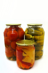 Home canning. Canned vegetables in glass jars on a white background