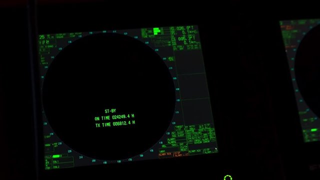 Instrument panel of ship in twilight, in lamplight. Close-up.